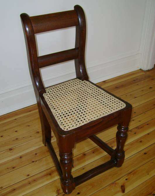 Early Australian hand caned cedar chair